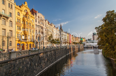 Prague colorful historic houses on the river Vltava shore