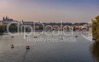 river Vltava prague and tourist boats in the golden evening sun