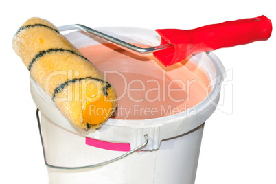 Paint roller on a bucket with paint