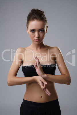 Portrait of beautiful slim girl engaged in yoga