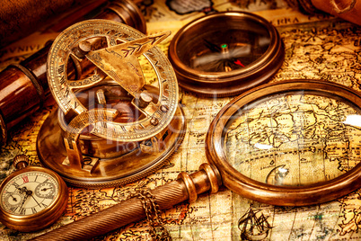 Vintage magnifying glass lies on an ancient world map