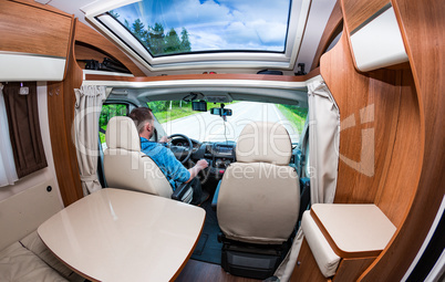 Man driving on a road in the Camper Van