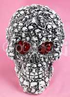 skull head toy on pink background