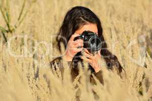 Young, pretty lady photographer