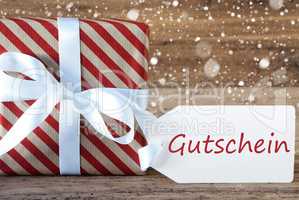 Present With Snowflakes, Text Gutschein Means Voucher