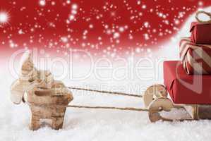 Reindeer With Sled, Red Snowflakes Background, Copy Space