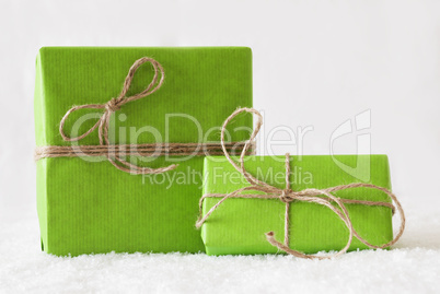 Two Green Gifts Or Presents On Snow, White Background