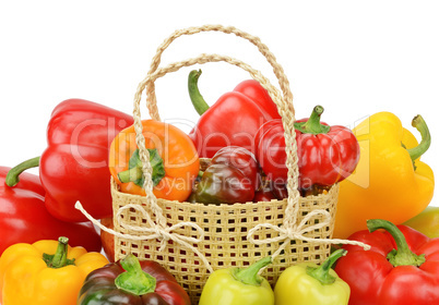 Set bell peppers in a basket isolated on a white background