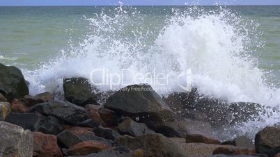 Rocky Shore and Splash of the Surf. Slow Motion
