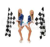Cute girls posing with checkered flags at camera