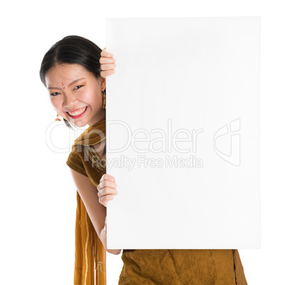 Punjabi woman holding blank white paper card.