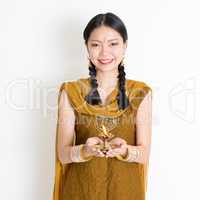 Woman holding Diwali light