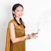 Woman holding diya light