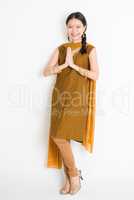 Indian Chinese woman greeting