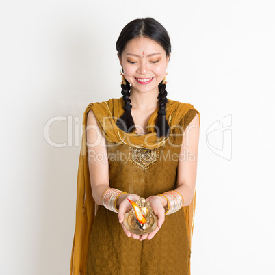 Girl holding oil lamp light