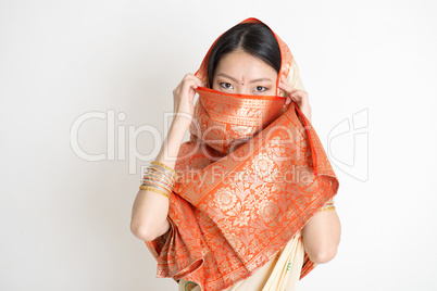 Secrecy young girl in Indian sari dress