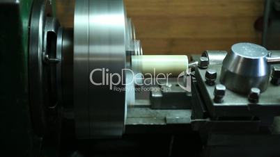 Milling detail on metal cutting machine tool