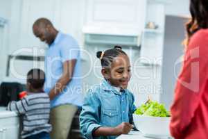 Girl smiling while preparing food