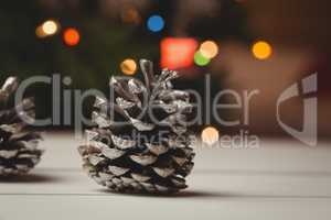 Close-up of pine cone on wooden table