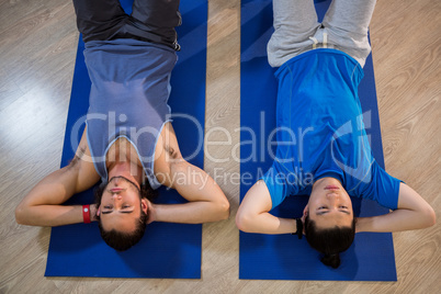 Men exercising on exercise mat