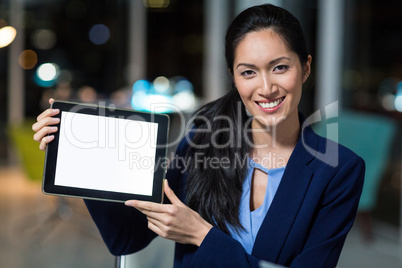 Businesswoman showing digital tablet Businesswoman showing digital tablet
