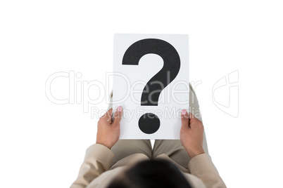 Businesswoman holding a question mark sign