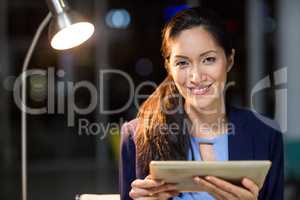 Businesswoman holding digital tablet