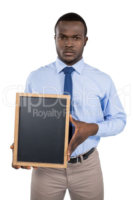 Businessman holding a blank board Businessman holding a blank board