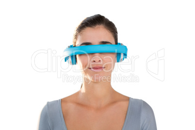 Smiling woman in exercise outfit using virtual video glasses