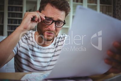 Worried man looking at his bills