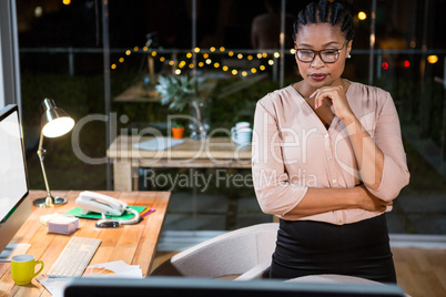 Businesswoman looking at computer screen