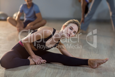 Woman performing stretching exercise