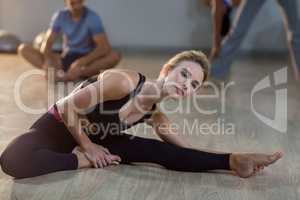 Woman performing stretching exercise