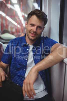 Portrait of man traveling in train