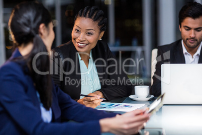 Businesswoman interacting with a colleague