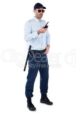 Security officer holding a walkie-talkie
