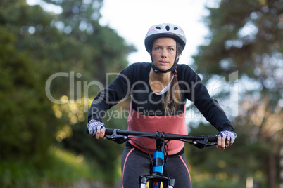 Female biker cycling in countryside