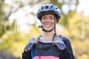 Female biker smiling with backpack