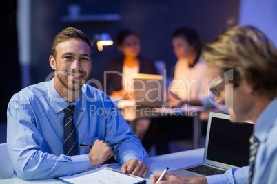 Businessman preparing document in conference room