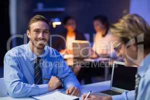 Businessman preparing document in conference room