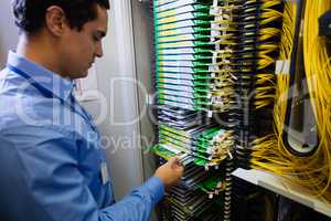 Technician checking routers