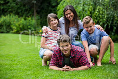 Happy family smiling in park