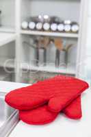 Red Oven Gloves Mittens in a Modern Kitchen