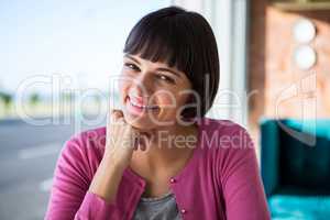 Smiling woman sitting in a coffee shop