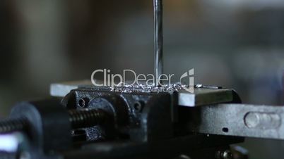 Drill tool in chuck during metal cutting process