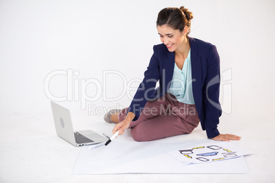 Businesswoman preparing a chart with icons