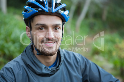 Portrait of male mountain biker in the forest