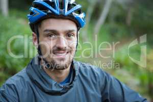 Portrait of male mountain biker in the forest