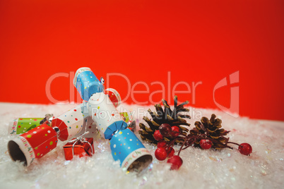 Christmas crackers and christmas decoration on snow