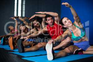 Young friends doing stretching exercise